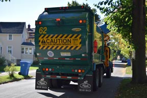Recycling truck service at curb
