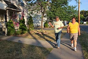 Walkers talk about new additions to neighborhood houses in Marketview Heights