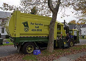Refuse collection truck and operator