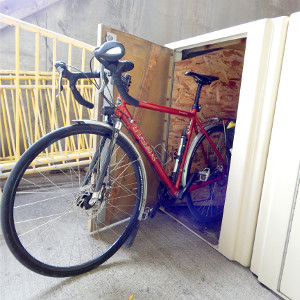 Bike halfway inside bike locker